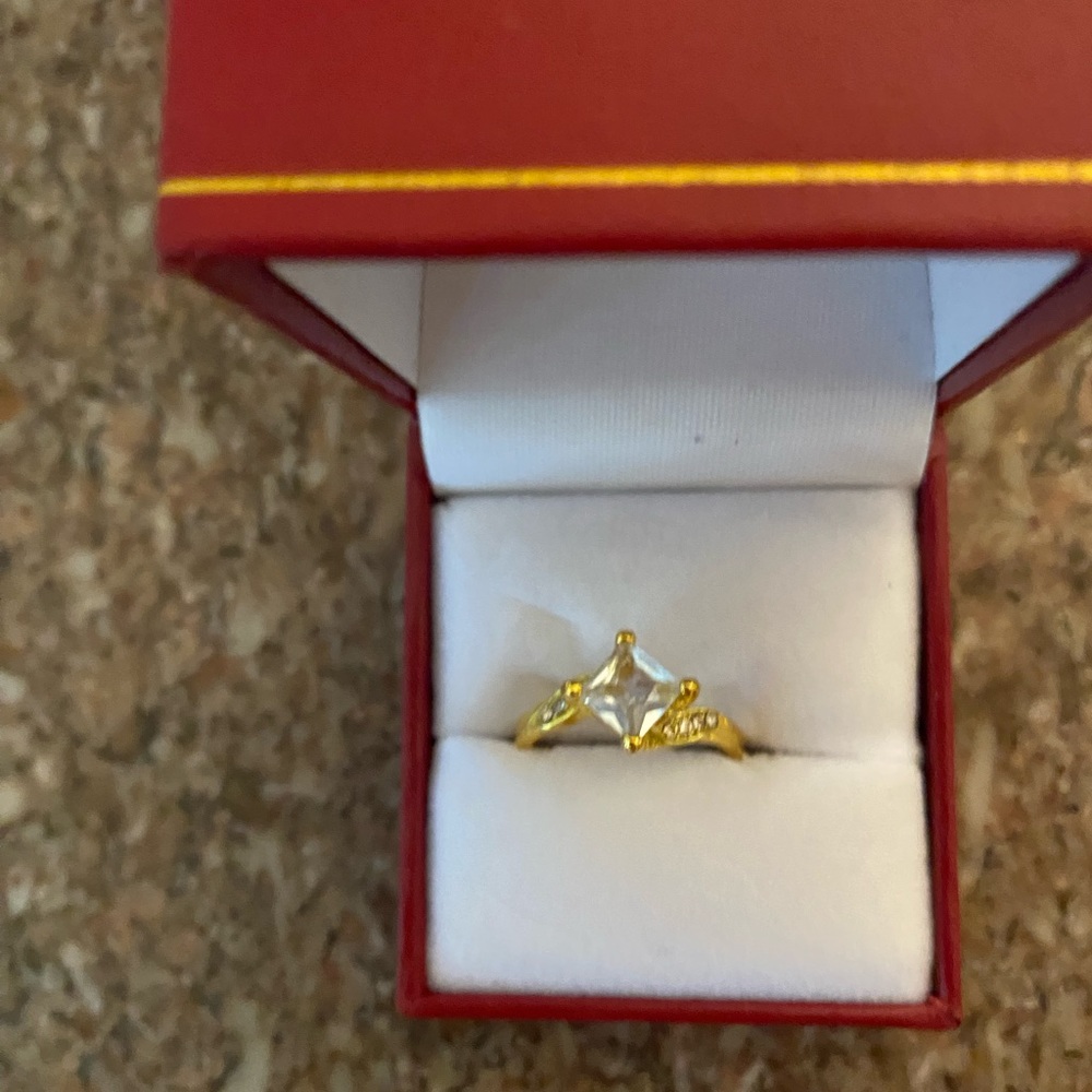 Pretty square cut cubic in gold setting